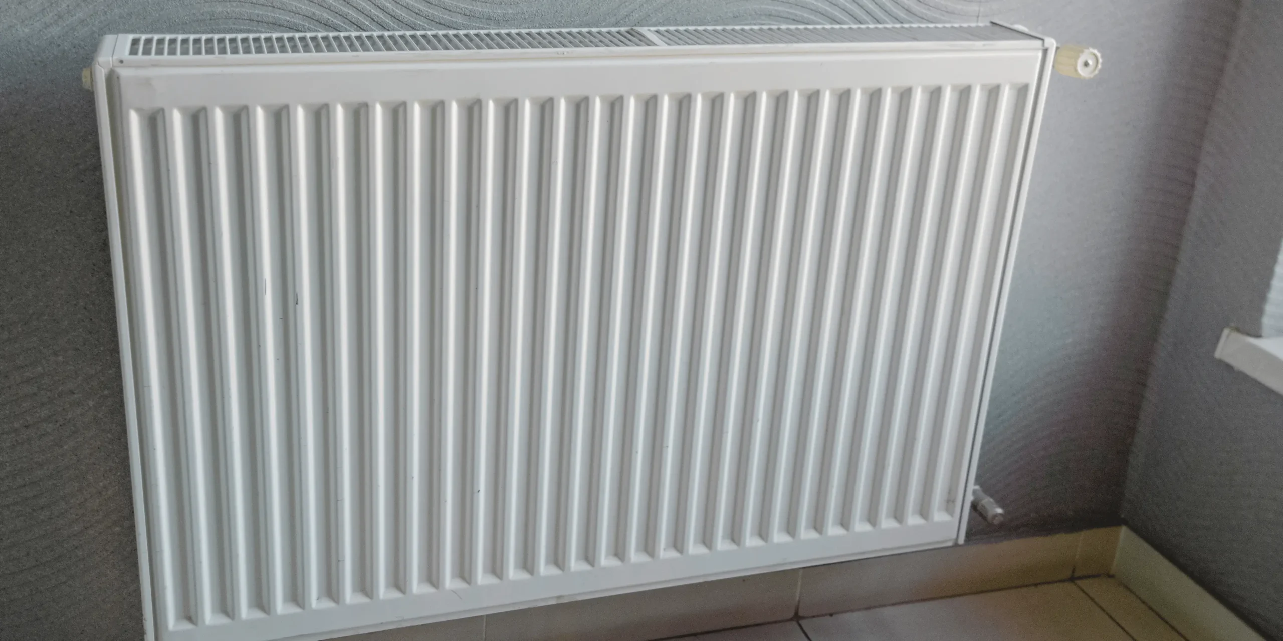 Radiátor v bytové jednotce.